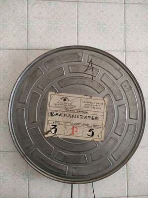 Film canister used from the movie Balkanizater with distribution slip