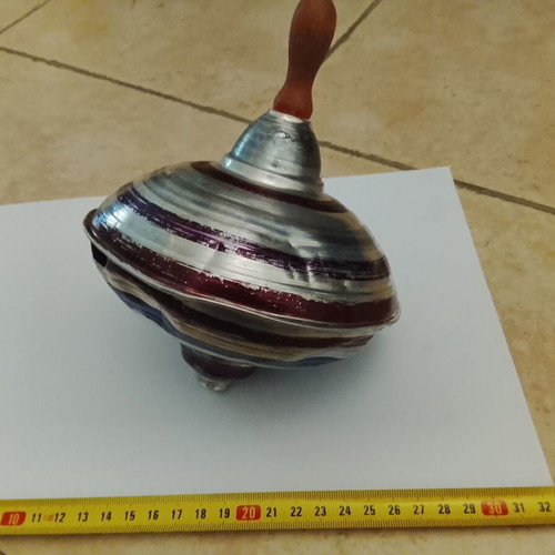 Vintage metal mechanical spinning top used