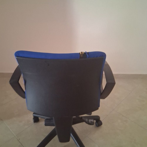 Office chair with fabric defect