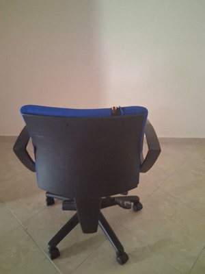 Office chair with fabric defect