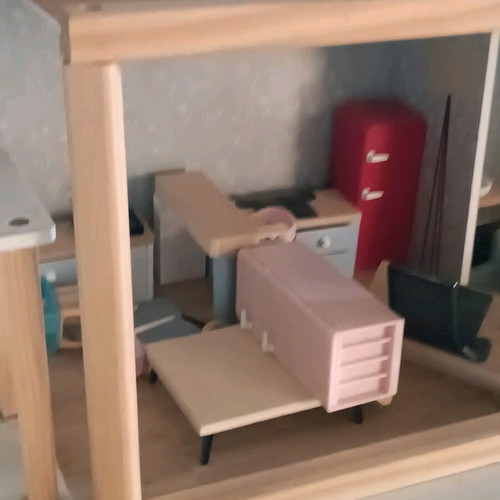 Wooden dollhouse used with extra accessories pack