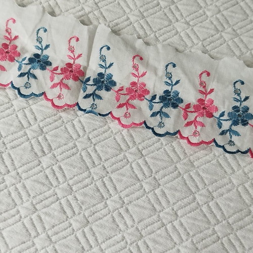 Cotton machine lace with pink and blue flowers