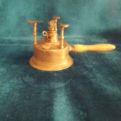 Vintage brass gas burner used with slight base deformation