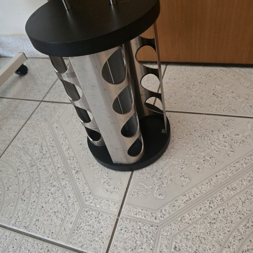 Rotating spice rack with 16 slots for round jars