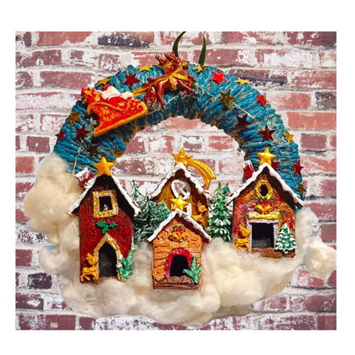 Handmade wreath Santa Claus with sleigh in Christmas village lit with LED