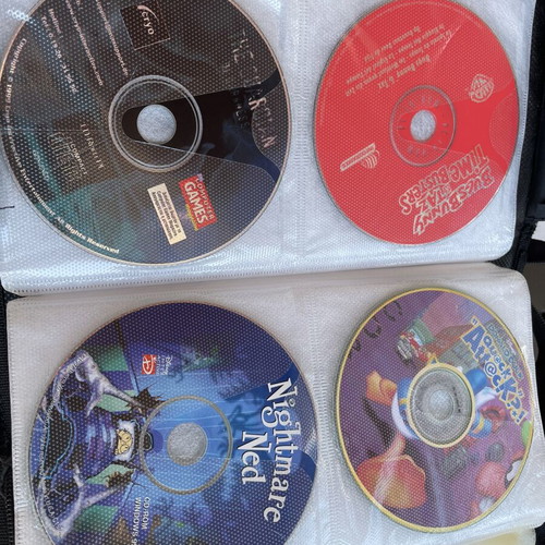 Vintage PC and PlayStation 2 gaming bundle with case, 70 CDs/DVDs