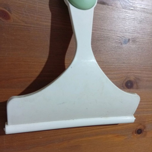 Window scraper used for cleaning glass