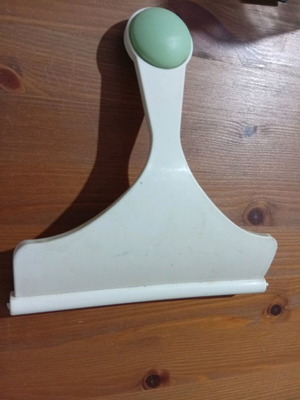Window scraper used for cleaning glass