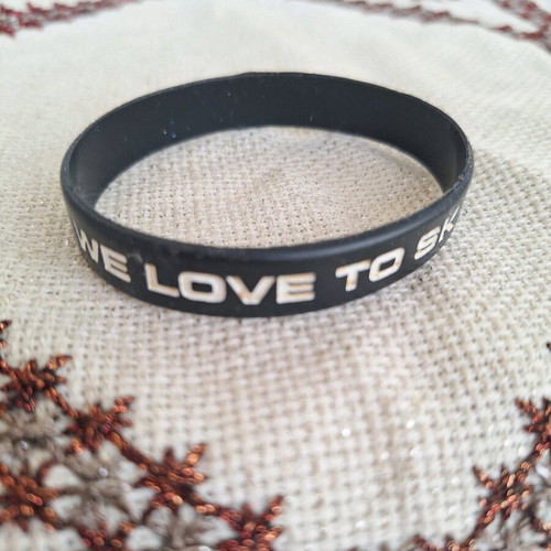 Black elastic rubber bracelet with letters used