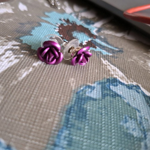 Rose shaped earrings purple used