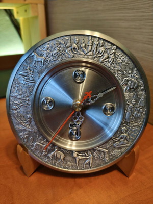 Metal clock with stand like new from Thailand