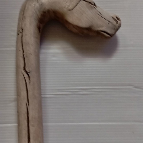 Wooden carved walking stick used with horse head handle