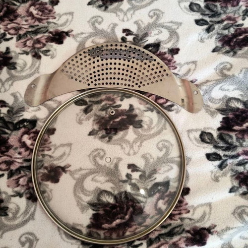 Strainer for pot and lid without knob used, all together