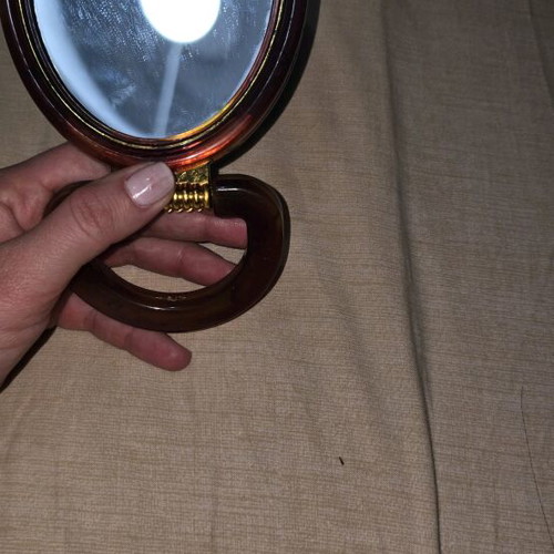 Hand mirror with two sides like new for magnification and reduction