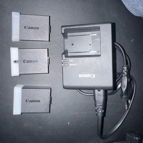 Canon EOS 2000D camera with 3 batteries and extras, like new
