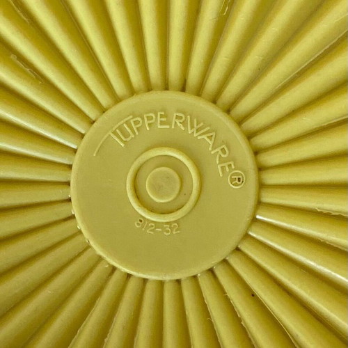 Vintage Tupperware container used yellow with radial lid