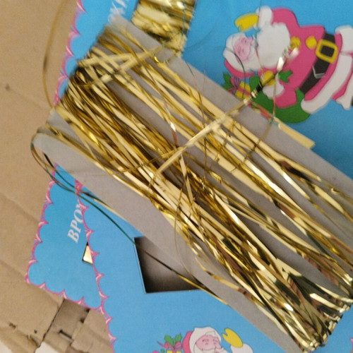 Vintage Christmas tinsel in red, gold and silver
