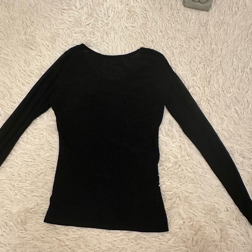 Black blouse used with gold metallic design and mesh sleeves