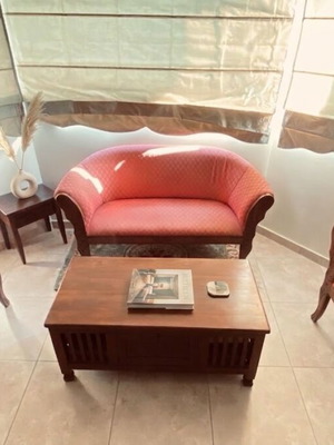 Vintage sofa set with carved wood and peach fabric