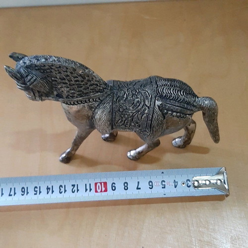 Vintage metal horse used with carved details