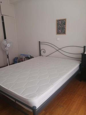 Double mattress used with visible tears, no frame