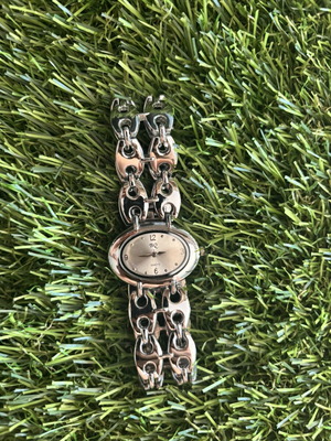 Quartz wristwatch used, silver color, original strap design