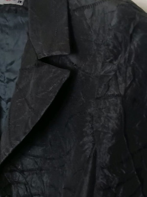 Black jacket used with shiny fabric