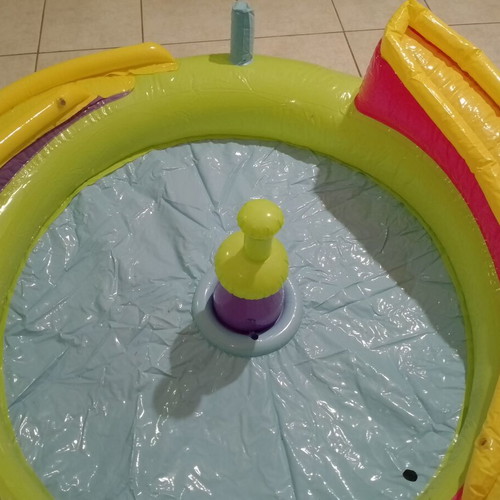 Inflatable colorful playpen used with balls and slides