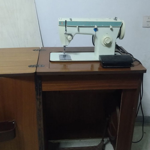Singer 258 sewing machine like new with cabinet and table stand