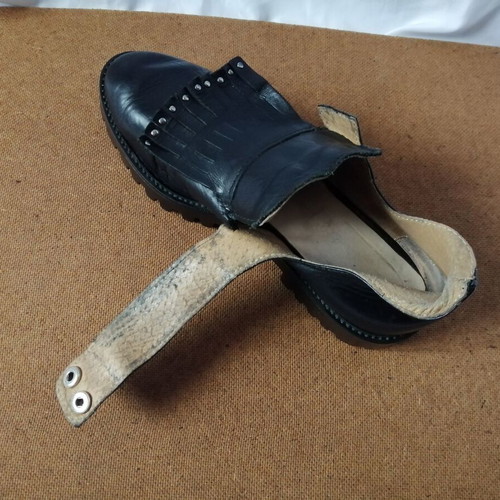 Women's black leather loafers with tassels and snap buttons, size 37