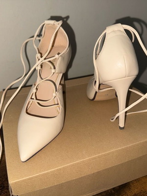 Beige leather Migato pumps with long straps, like new