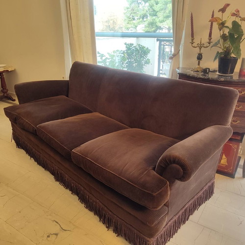 Handmade sofa used with brown velvet upholstery and walnut legs