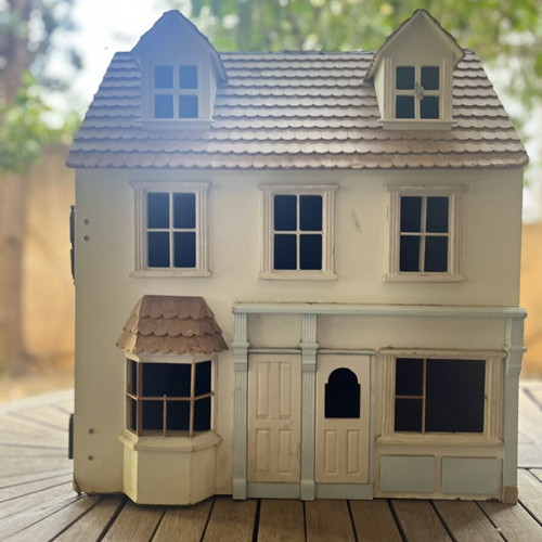 Vintage wooden dollhouse used with unique architecture