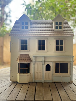 Vintage wooden dollhouse used with unique architecture