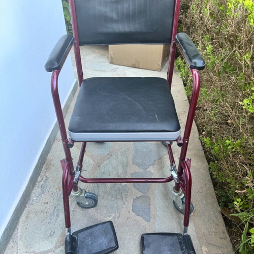 Red toilet wheelchair like new, missing container