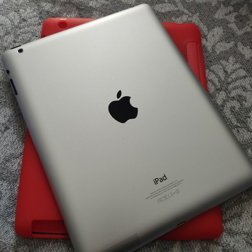 Apple iPad tablet like new, older model with red case