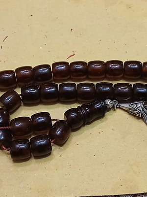 Amber worry beads used with silver elements and tassel