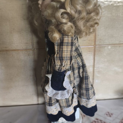 Porcelain doll vintage collective used with dress stains