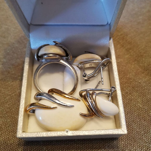 Silver 925 set with white stones used, possibly white coral