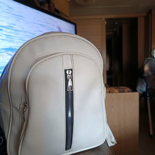 White backpack with front zipper, almost like new