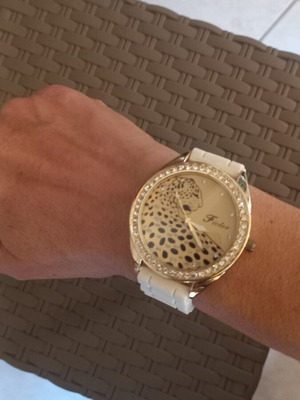 Women's wristwatch with rhinestones, white plastic strap