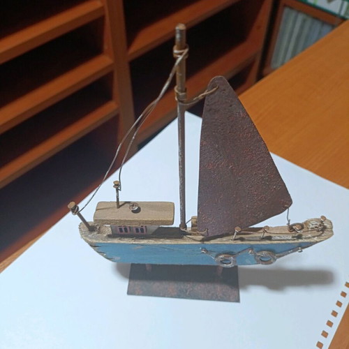 Wooden boat with metal sail unused