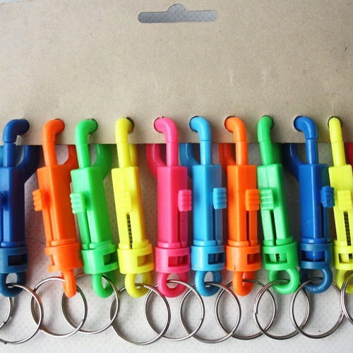 Card with 12 vintage 1980s phosphorescent key chains, new