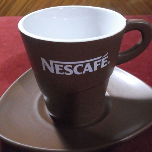 Nescafe collectible ceramic cup and saucer set like new