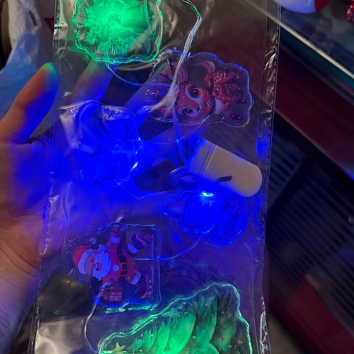 Christmas LED string lights with transparent shapes set new