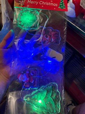 Christmas LED string lights with transparent shapes set new