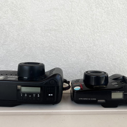 Olympus Super Zoom and Nikon Zoom Touch 600 cameras used