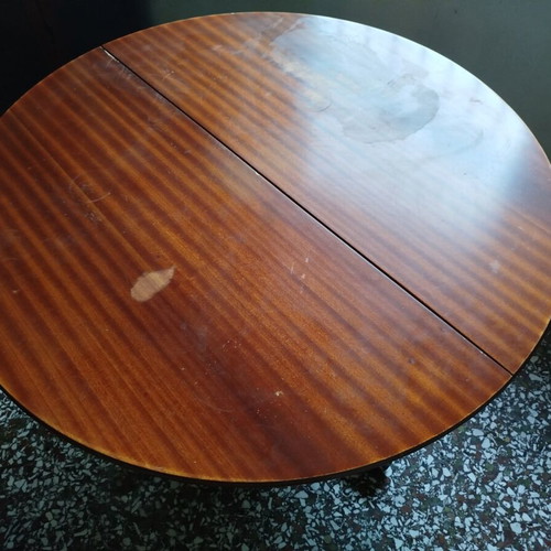 Round table with red tablecloth used, vintage wood design