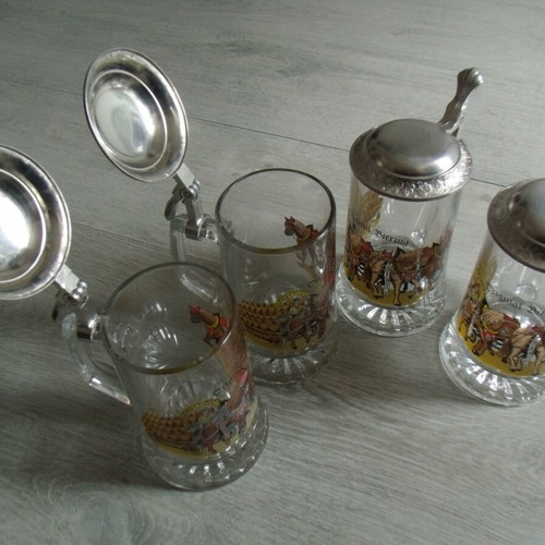 Set of 4 old glass beer steins with metal lids used