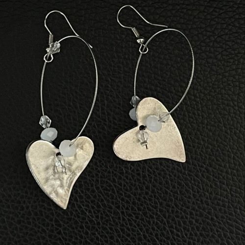 Hammered metal earrings with white beads